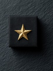 Poster - Elegant Black Gift Box Adorned With a Gold Star in a Minimalist Design on a Textured Background