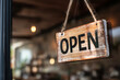 © Anoo - Welcoming open sign in a cozy coffee shop inviting customers to enjoy a warm atmosphere