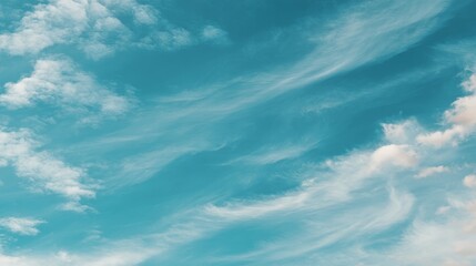Fototapete - Experience a peaceful view of a soft turquoise sky adorned with delicate white clouds, inviting calmness and tranquility on a beautiful day