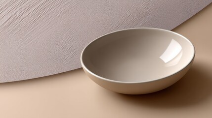 Poster - A white bowl sits on a table with a patterned cloth underneath it