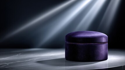 Poster - A purple velvet box sits on a table in front of a light