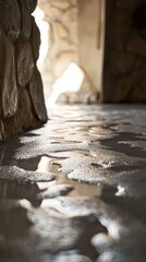 Poster - Wet stone floor reflecting light in cave interior low angle shot creating abstract patterns and textures in natural light