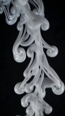 Poster - Mesmerizing swirl of white ink in water creating intricate patterns against black background