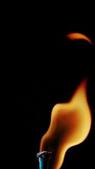 Poster - Dynamic flame movement captured on black background with lighter