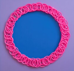 Aufkleber - Pink Rubber Band Circle Frame: A vibrant, playful circular frame composed of numerous interconnected pink rubber bands encircling a solid blue center against a soft purple background.