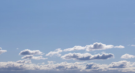 Wall Mural - serene image of a clear blue sky adorned with scattered wispy clouds