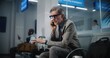 © Framestock - International Airport Terminal: Successful Man Getting Angry About Canceled or Delayed Flight, Talking on Phone. Serious Businessman Sitting in Departure Lounge, Going on Business Trip. Slow Motion.