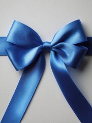 Leinwandbilder - Close-up of a Beautiful Blue Ribbon Bow on a Light Background Creating an Elegant Decoration for Gifts or Crafts