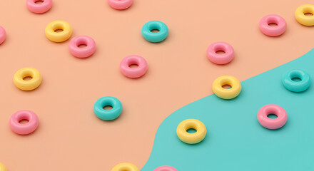 Leinwandbilder - Scattered torus shapes in pink, yellow, and turquoise on a split peach and turquoise background create a playful, colorful, and modern design element.