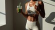 © Анастасия Макевич - Sporty woman in light activewear with green smoothie