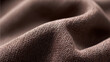 © MasTPX - A close-up shows the intricate weave and soft texture of a luxurious brown fabric, creating a sense of warmth and comfort, ideal for textile designs.