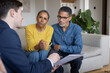 © ReeldealHD images - Worried couple engaging with Advisor in Home Setting