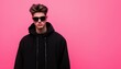 © Cortex - Stylish young man in black hoodie and sunglasses