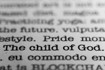 Poster - The child of God. Text printed on a page. A piece of paper with a phrase written in retro typewriter font
