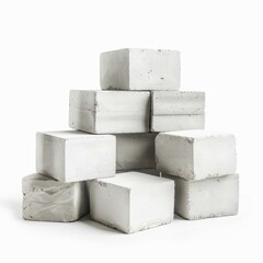 Poster - concrete blocks stacked in a pyramid shape, creating a sturdy and geometric structure against a clea