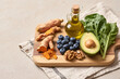 © Ira - Flat Lay of Anti-Inflammatory Foods – Turmeric, Blueberries, Avocado, Olive Oil, Greens, Walnuts