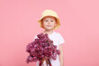 © New Africa - Little boy with bouquet of lilac flowers on pink background