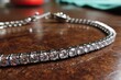 © ChaoticMind - Elegant silver bracelet adorned with sparkling crystals displayed on a wooden table
