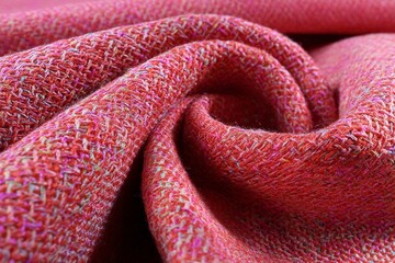 Poster - Rich textured fabric in vibrant shades of pink showcasing intricate weave details and softness in close-up view