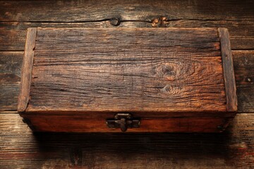 Poster - Rustic wooden box placed on a weathered wooden surface, showing unique textures and craftsmanship details