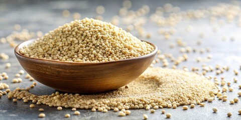 Aufkleber - A rustic wooden bowl overflowing with creamy-colored millet grains, spilling onto a textured surface, showcasing the tiny seed's detail and natural texture.