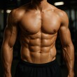 © Boke - Bodybuilder showing his muscular torso in the gym