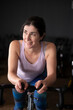 © FotoAndalucia - woman training in spinning room at gym