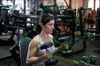 © FotoAndalucia - 40-year-old woman training with dumbbells in the gym