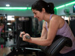 © FotoAndalucia - woman training exercises in gym with weights
