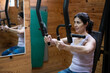 © FotoAndalucia - woman training exercises in gym with weights