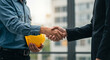 © nadialia - Construction Partnership: Engineer and Investor Shake Hands on New Building Project