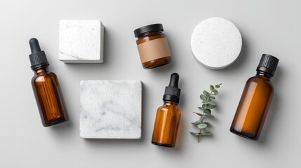 Poster - Amber dropper bottles and white cosmetic jars are geometrically arranged on a white marble surface, with soft lighting enhancing their glossy textures