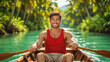 © f_bossa - A smiling young man with tan skin and dark hair rows a wooden boat on a tranquil turquoise river surrounded by lush tropical foliage.