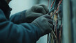 © Velem - Electrician Working on Electrical Panel
