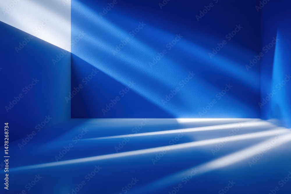 Bright blue walls create an abstract space filled with angled shadows and light patterns. The interplay of light emphasizes the minimalist design and enhances the vibrant atmosphere.