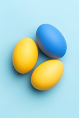 Poster - Easter eggs arrangement on blue background studio shot top view colorful eggs holiday decoration