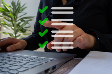 Poster - A woman is using a laptop with a green check mark on it. She is pointing at a list of items on the screen