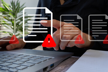 Poster - A woman working on a computer pointing at a document with a red alert sign