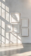 Aufkleber - Gallery wall mockup featuring five white frames on a textured wall with sunlight shadows interior design minimalist style