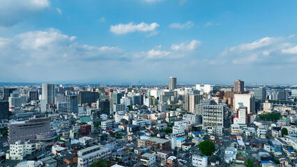 Leinwandbilder - 現代都市と青空の空撮風景