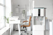 © Pixel-Shot - Water cooler in light office interior