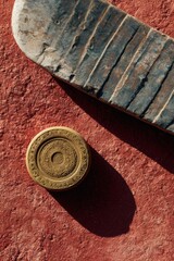 Aufkleber - Minimalist Ice Hockey Aesthetic Textured Blade and Golden Puck on Rich Terracotta Surface - Dynamic Sports Branding and Creative Marketing Visual