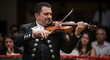 © mhmdyatt - Man Playing Violin in Formal Attire with Audience