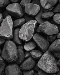 Poster - Close up of Smooth Black River Rocks Texture Background in Heap Vertical Shot for Landscaping Projects