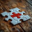 © guilherme - Red Puzzle Piece Placed in the Center of Completed Puzzle on Rustic Table