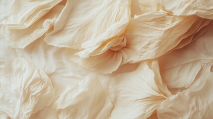 Poster - Abstract Close-Up of Creamy Fabric Folds Creating Soft Texture and Gentle Shadows in Studio Lighting for Backgrounds and Overlays