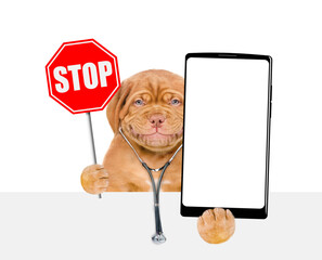Aufkleber - Smiling Mastiff puppy wearing like a doctor with stethoscope on his neck showing stop sign and big smartphone with white blank screen in it paw above blank white banner. isolated on white background