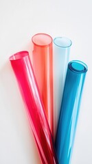 Poster - colorful transparent plastic sheets grouped on white background in studio shot overhead angle