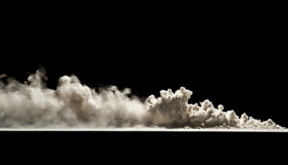 Poster - A dramatic cloud of beige dust against a black background.