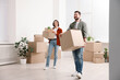 © New Africa - Moving day. Happy couple with their belongings in new home